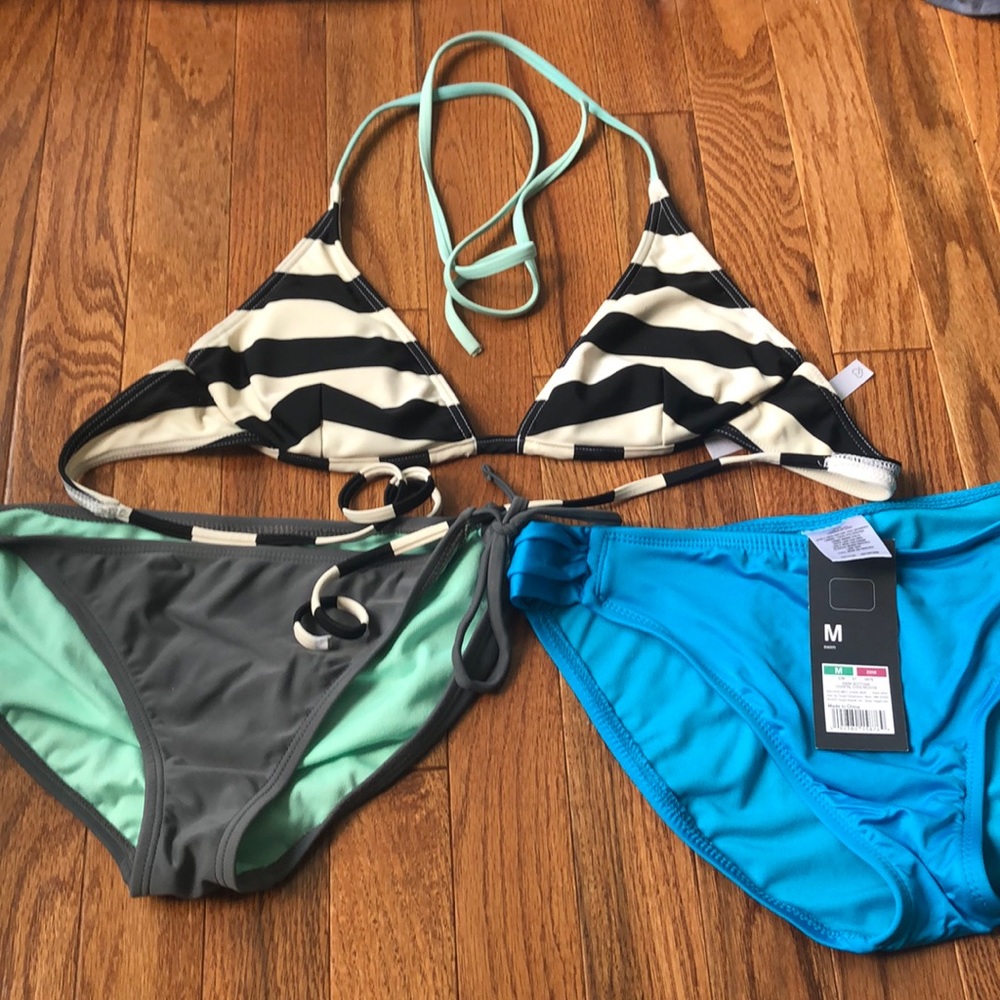 One bathing suit top and two bottoms